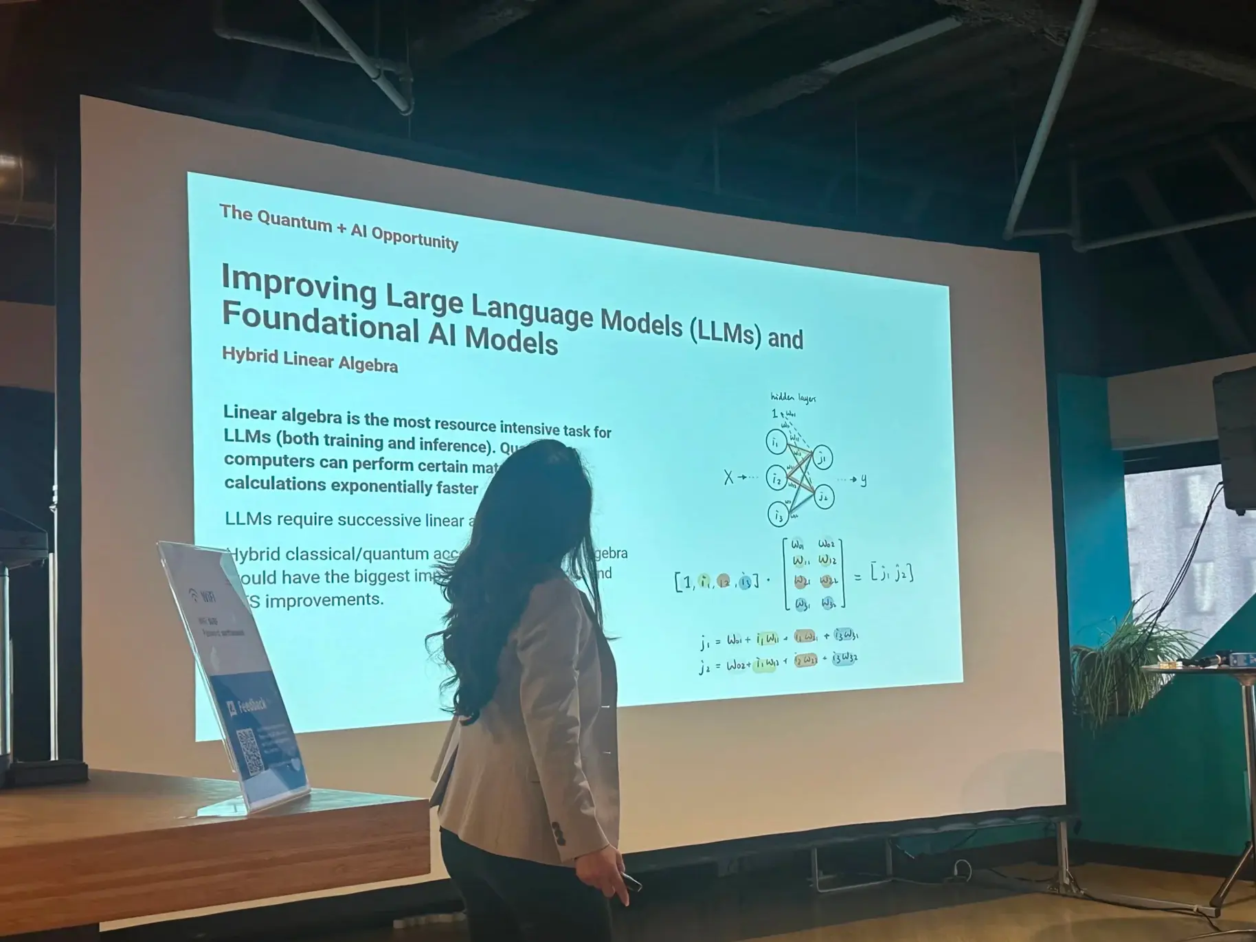 Speaker presenting on large screen