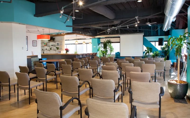 Cafe event space with theater style seating for corporate, presentations, conferences, fundraisers at SURF Incubator In Seattle WA